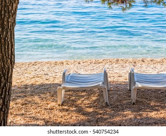 Deck Chairs On The Beach In Tucepi Croatia.