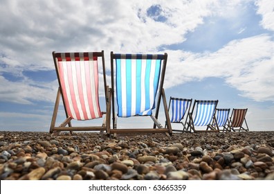 Deck chairs on Brighton beach, UK