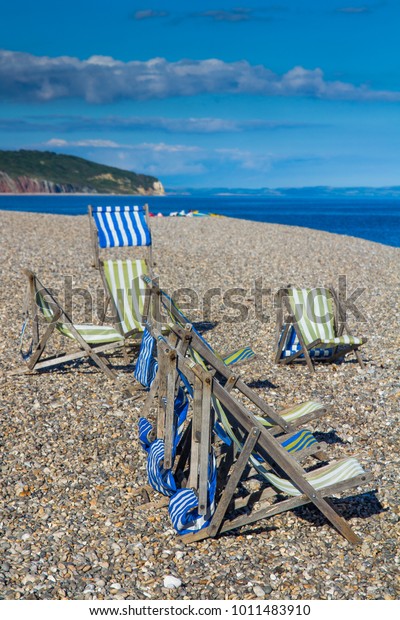Deck Chairs On Pebble Beach Fishing Stock Photo Edit Now 1011483910