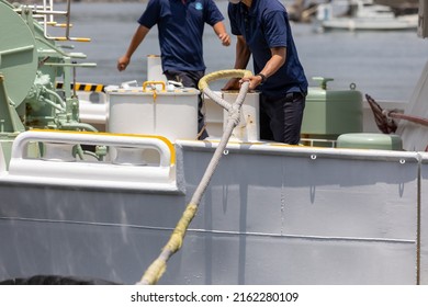 Deck Crew Mooring At The Bow Of The Ferry