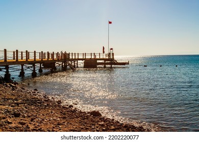 A Deck Crossing The Red Sea In Sunset. Dahab Egypt