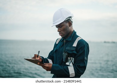 Deck Officer on deck of vessel or ship fills checklist