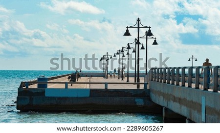 deck pier promenade with street lamp at seaside. deck pier promenade pathway.