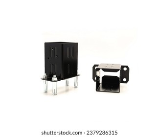 Deck post fence base bracket with attached bolts, support for wood to concrete slab connect made of thick steel, black powder coated rust-resistant isolated on white background. 4x4 nominal lumber