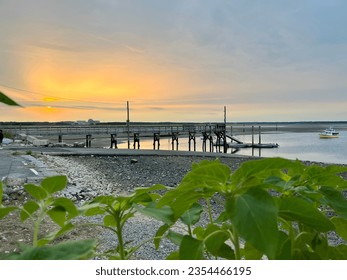 Deck in small village Salisbury, Massachusetts in the United States at sunset. Fishermen’s village. The gulf of main ocean in the Hampton river and Blackwater river. - Powered by Shutterstock