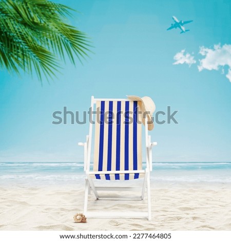 Deckchair on the tropical beach: summer vacations concept
