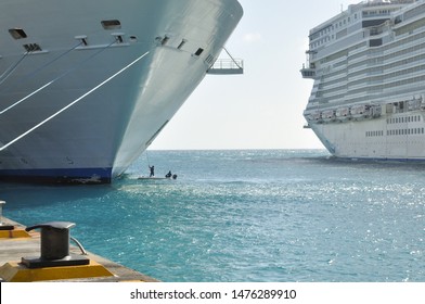 Deckhands cleaning a cruise ships bow