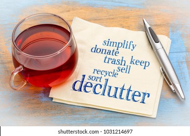 declutter and simplify word cloud on a napkin with a cup of tea - Shutterstock ID 1031214697