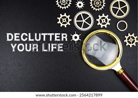 Declutter Your Life text message with magnifying glass on black background