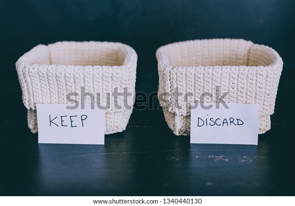 decluttering and\
tidying up concept: storage baskets to divide items to keep from\
those to declutter or\
donate