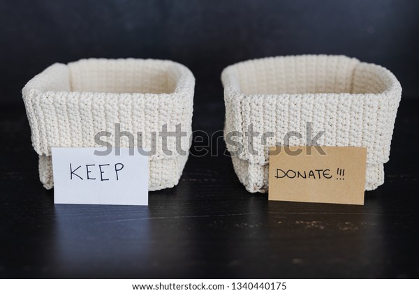 decluttering and
tidying up concept: storage baskets to divide items to keep from
those to declutter or
donate