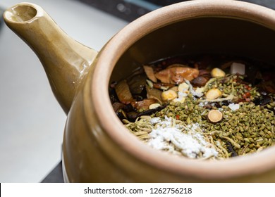 decocting Chinese medicinal herbs with enamel pot - Shutterstock ID 1262756218