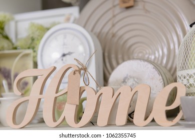 Decor For Home In Pastel Colors In The Shop. Wooden Sign Home, Close-up.