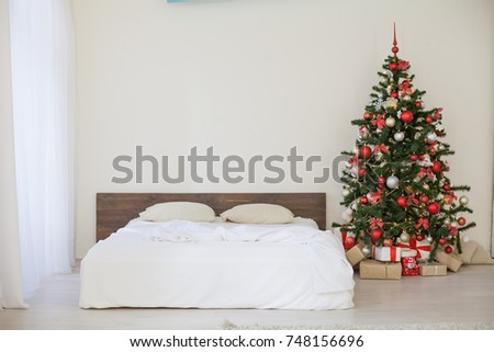 decor white bedroom with Christmas tree Christmas gifts