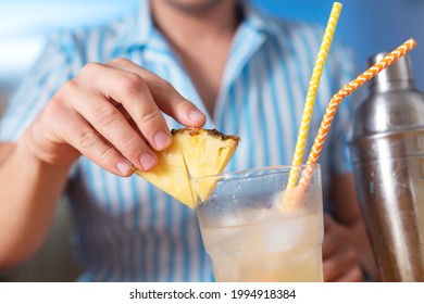 Decorate The Cocktail With A Pineapple Wedge