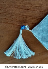 Decorate The End Of The Tablecloth With Blue And White Beads With Loose Threads