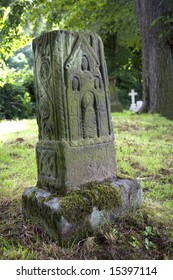 Decorated Anglo-Saxon stone cross in graveyard
