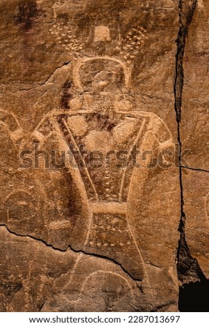 A decorated anthropomorphic warrior figure, part of the Dry Fork Canyon ancient Fremont petroglyphs located near the town of Vernal in northeastern Utah, United States.