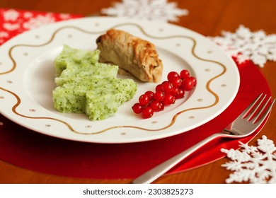 Decorated Christmas dining table with tasty veal and mashed potatoes with broccoli in form of a Christmas tree  - Powered by Shutterstock