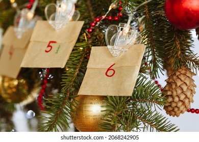 Decorated Christmas Tree Branch With Hanging Advent Calendar Made By Your Own Hands. High Quality Photo