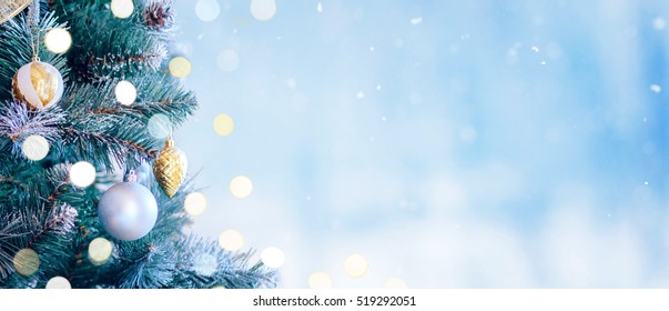 Decorated Christmas Tree With Bright Bokeh On Winter Blue Snowy Background. Christmas Banner. 