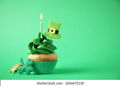 Decorated cupcake on green background, space for text. St. Patrick's Day celebration - Powered by Shutterstock