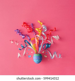 Decorated Easter Egg With Party Streamers On Pink Background. Easter Concept. Flat Lay.