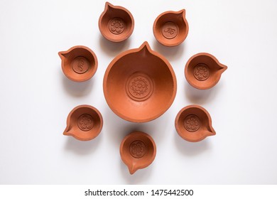 Decorated With Empty Terracotta Oil Lamp On White Background.