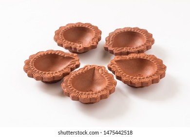 Decorated With Empty Terracotta Oil Lamp On White Background.