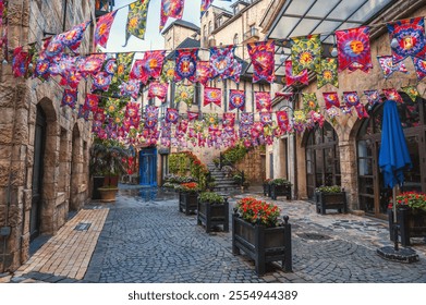 Decorated festive streets of the medieval stone town in French village in Ba Na Hills Park in Da Nang in Vietnam - Powered by Shutterstock