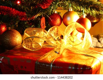 Decorated gift box under the Christmas tree - Powered by Shutterstock