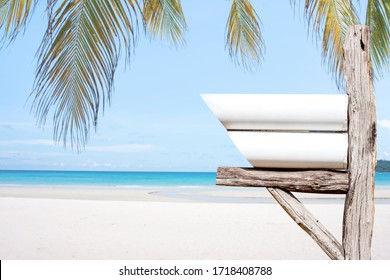 decorated mail box on  log wood over tropical beach background.