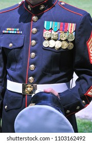 Decorated Marine In Dress Blues Displaying Medals