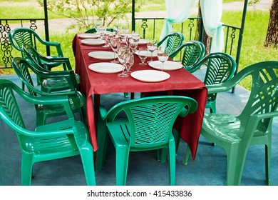 Decorated Table, Plastic Furniture In Pavilion Of Outdoor Cafe.