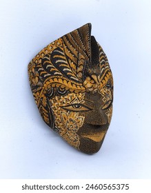 Decorated wooden masks from Java with batik motifs with bird crowns