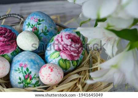 Decorating Easter eggs with decoupage technique. Eggs in a basket