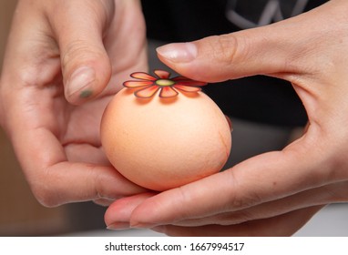 Decorating eggs in the kitchen. Orthodox Easter holiday.