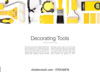 Decorating And House Renovation Tools And Accessories On White Background. Flat Lay Composition In Yellow Colors With Copy Space