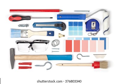 Decorating And House Renovation Tools And Accessories On White Background Top View. Flat Lay Composition In Red And Blue Colors