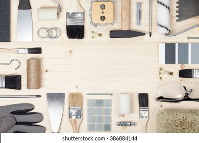 Decorating And House Renovation Tools And Accessories On Wooden Background. Flat Lay Frame Composition With Copy Space Top View