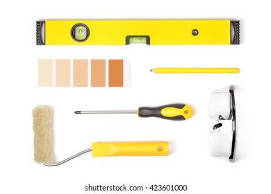 Decorating And House Renovation Tools On White Background. Painter And Decorator Working Table. Flat Lay Composition In Yellow Colors