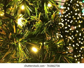 Decorating The Lamp At The Christmas Tree.