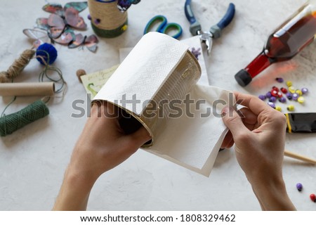 Decorating tin cans with decoupage napkins with using various decor elements. Do it yourself. Step by step. Step 7. Gluing the base, white napkin on the tin. There is no waste. Other uses of packaging
