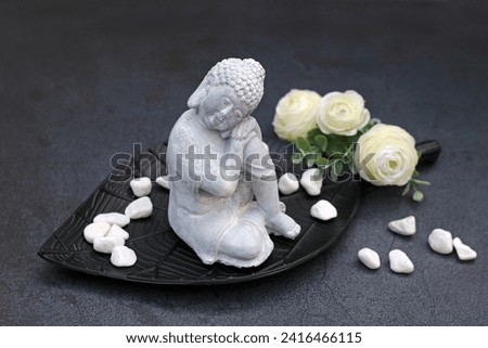 Decoration with Buddha figure and flowers.