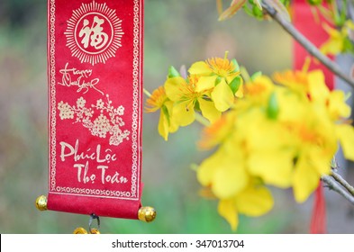 Decoration item for Lunar new year with text "Happy new year" in Vietnamese
