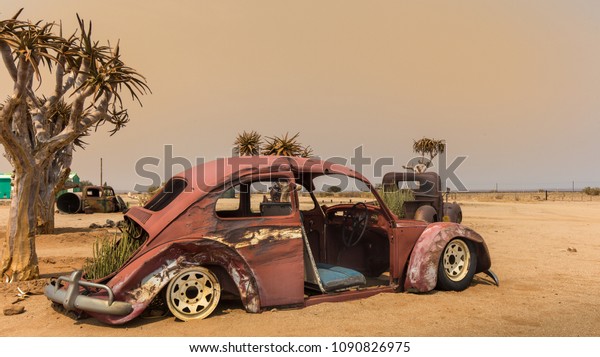 decoration with an\
old car in a desert\
station