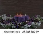 Decoration for the second Advent: Advent wreath with purple candles.