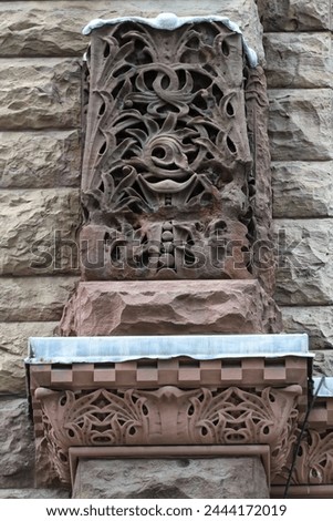 Decoration in stone. Colonial architectural feature or detail in Old City Hall Building (1898), Toronto, Canada