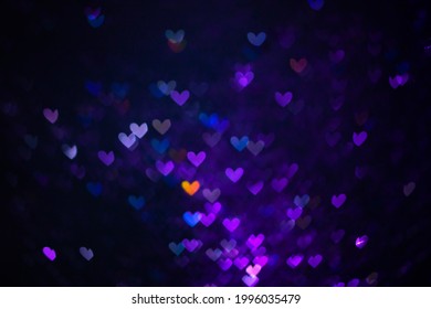 Decoration Twinkle Glitters Background, Abstract Shiny Backdrop With Hearts, Modern Design Overlay With Sparkling Glimmers. Purple, Blue And Orange Backdrop Glittering Sparks With Glow Effect.