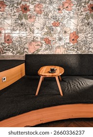 Decorations in a cafe with a 'work from cafe' theme, featuring wooden tables, cozy sofas, and power outlets available on every side